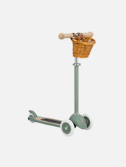 Green scooter with a wicker basket on a white background
