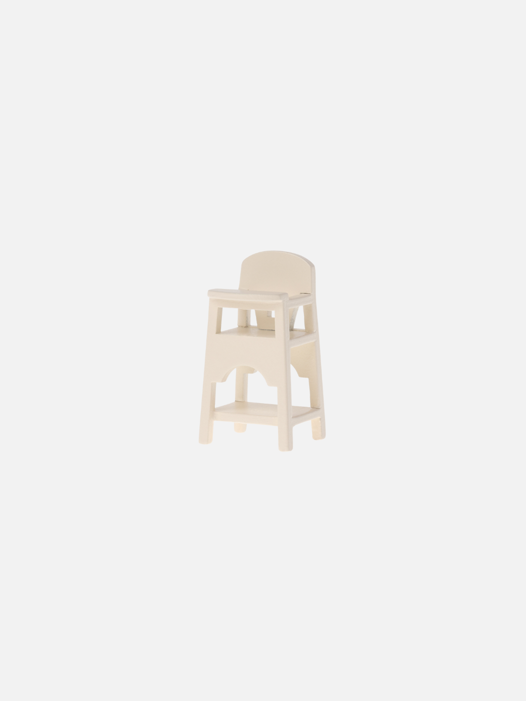 A tiny wooden highchair by Maileg